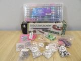 a box of beads and other items on a table