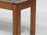 an image of a wooden bench sitting on top of a white floor