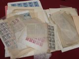 a pile of old stamps and envelopes on a table