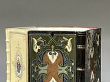 a small decorative box with a bear on it