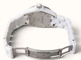 an image of a wrist watch with a white bracelet on a white surface