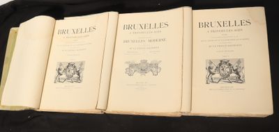 four books are lined up on a black table