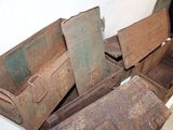 a pile of old rusty boxes sitting on the floor