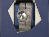 the watch is in a blue box with a diamond on it