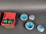 several small bowls and bowls sitting on a table next to a red box