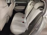 the back seats of a white car with black trims