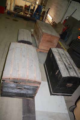 many suitcases that are sitting on the floor in the garage