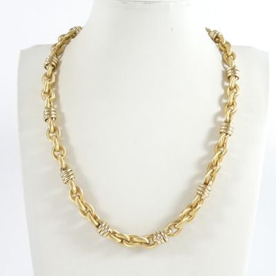 a close up of a necklace on a mannequin mannequin