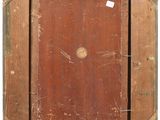 an old wooden picture frame with a hole in the middle
