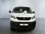 the white van is parked in a large room with a black floor