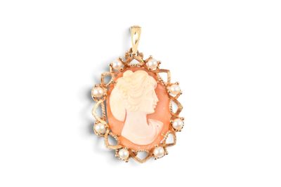 a close up of a pendant with a woman ' s profile on it