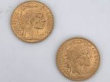 two gold coins, one of which is a sovereign and the other of which is a sovereign