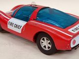 a toy car that is red and white with a blue roof