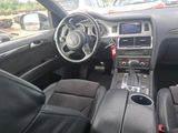 the interior of a car with black leather seats and steering controls