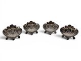 three silver plated bowls with handles on wheels on a white surface