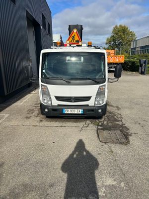 a white truck parked in front of a building