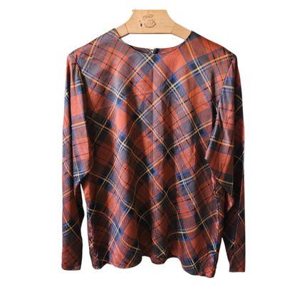 plaid shirt on hanger on wooden hanger against white background