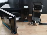 a microwave and a coffee maker sitting on a table