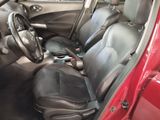 a picture of a red car with black leather seats