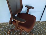 a brown office chair with a black seat and a brown seat