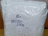 a bag of white paper sitting on top of a cardboard box