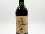 bottle of red wine with a red cap on a white background
