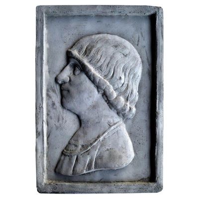 a close up of a sculpture of a woman with a headband
