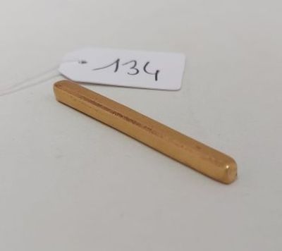 a small wooden stick with a price tag on it