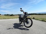 a motorcycle that is parked on the side of the road