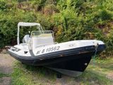 a boat that is sitting on the ground in the grass