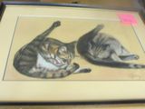 a picture of two cats that are sitting on a table