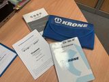 a blue case sitting on top of a table next to some papers