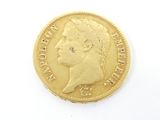 l'image d'une pièce d'or sur laquelle figure le visage d'un homme