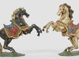 two horses that are standing next to each other
