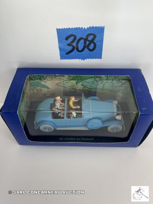une image représentant une petite voiture bleue à l'intérieur de laquelle se trouvent deux personnes