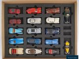 many toy cars in a box that are in a box