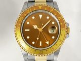a gold and silver wrist watch with a yellow face