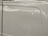 an image of a white van parked in a garage