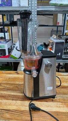 a blender sitting on top of a wooden table