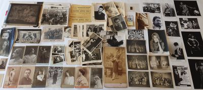 a lot of old photographs on the table together