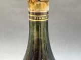 a bottle of wine that is sitting on a table