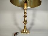 a lamp that is sitting on a table next to a wall