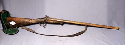 an old rifle with a wooden handle and a leather case