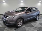 a picture of a grey nissan suv parked in a garage