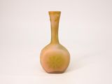 a small vase that is sitting on a white surface