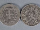 two silver coins, one with a coat of arms and the other with a crown