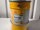 an image of a yellow bucket sitting on top of a white table
