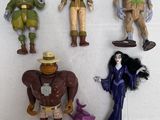 five action figures of different characters on a white surface