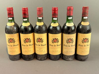 six bottles of wine lined up in a row on a table