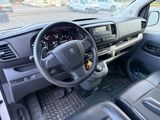 a dashboard of a car with a steering wheel and dashboard controls